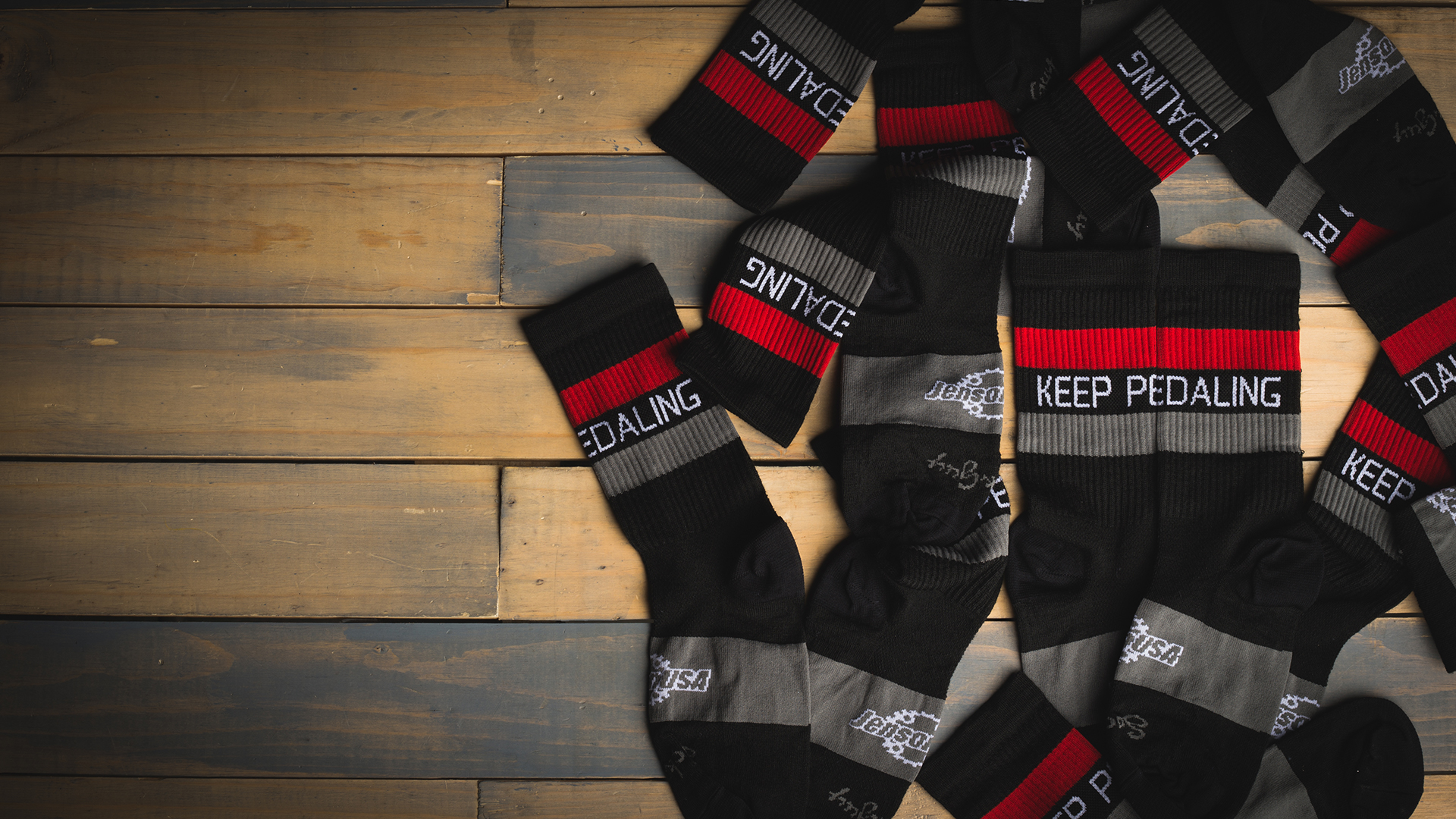keep pedaling socks flat lay
